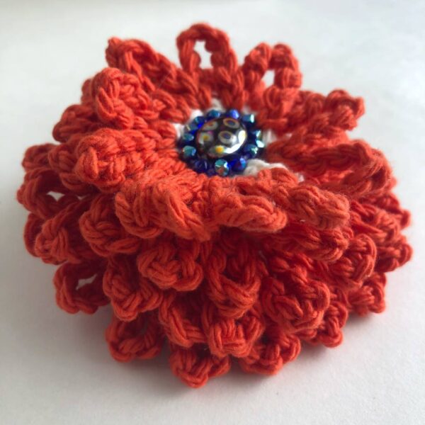 bright orange-red crocheted beaded flower brooch