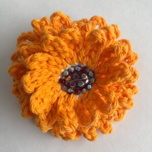 orange crocheted beaded flower brooch