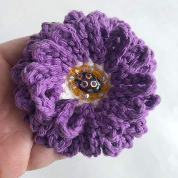 purple crocheted beaded flower brooch